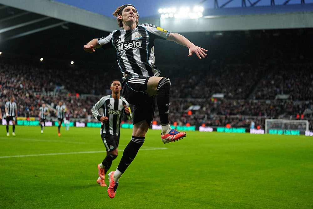 | Photo: Owen Humphreys/PA via AP : Newcastle United's Anthony Gordon celebrates after scoring his sides second goal during the English Premier League soccer match between Newcastle United and Burnley in Newcastle upon Tyne, England.