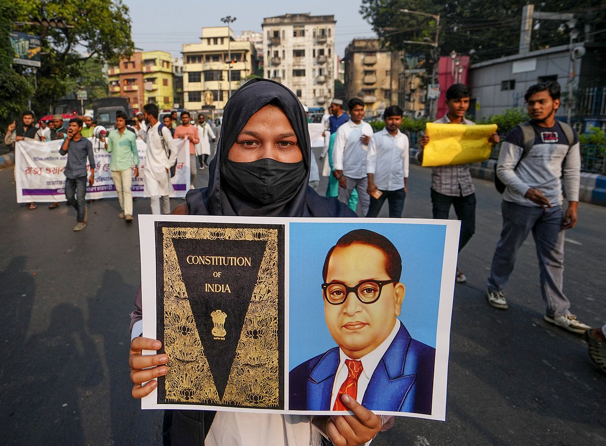 Manvender Vashist Lav : A student of Aliha University shows a placard during a protest rally demanding simplification of the process of including Waqf properties in the Waqf Portal and increasing of the time limit, in Kolkata, Thursday, Dec. 4, 2025. 