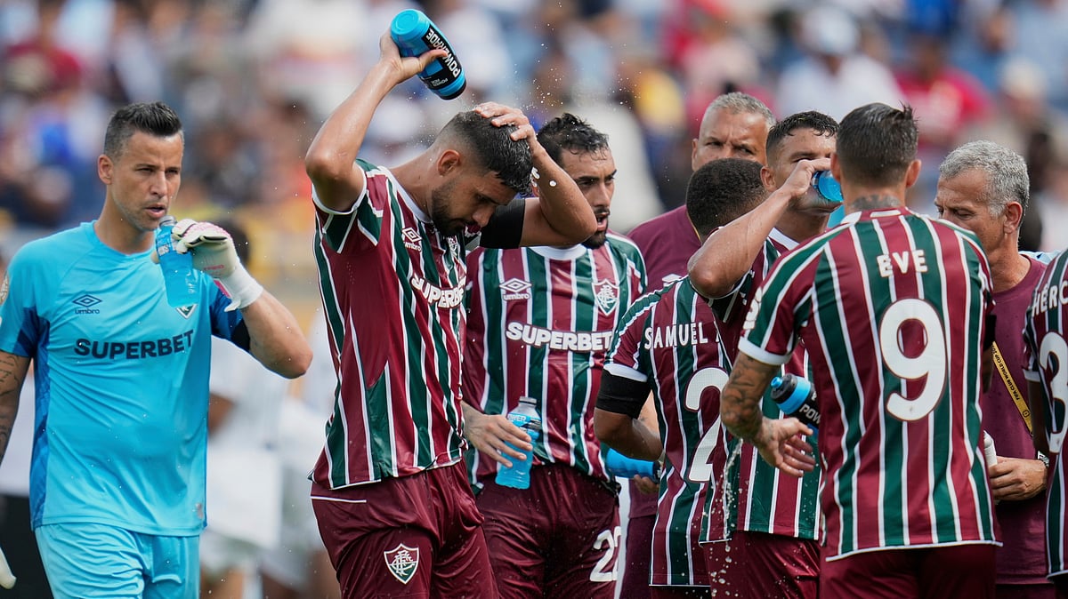 | Photo: AP/John Raoux : File photo of Fluminense players cooling up during a water break at the FIFA Club World Cup quarter-final match against Al Hilal in Orlando on July 4, 2025. 