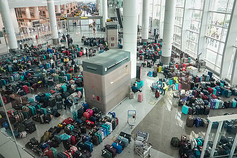Luggage of passengers piled up at the Indira Gandhi International Airport amid IndiGo flight disruptions, in New Delhi, Monday, Dec. 8, 2025. () ()