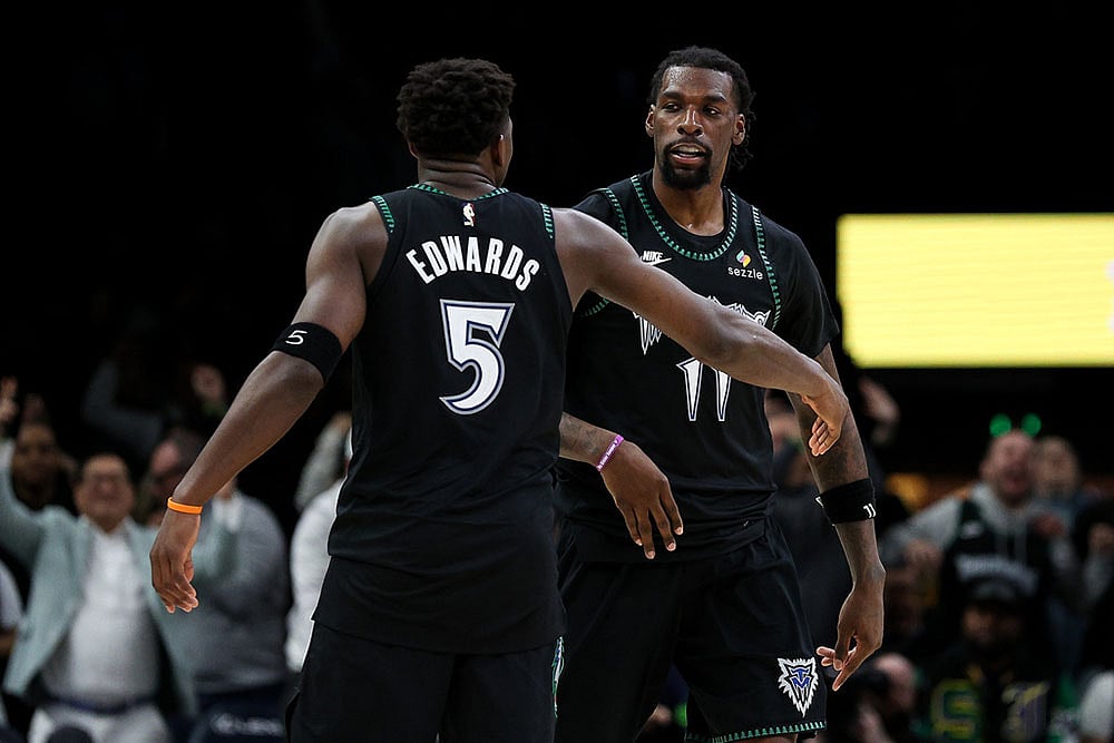 | Photo: AP/Matt Krohn : Minnesota Timberwolves center Naz Reid, right, celebrates  after a go-ahead 3-point basket with guard Anthony Edwards (5) during the second half of an NBA basketball game against the Los Angeles Clippers in Minneapolis.