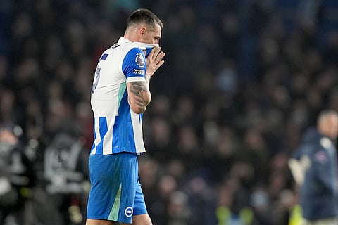 Brighton and Hove Albion's Lewis Dunk reacts after the English Premier League soccer match between Brighton and Hove Albion v West Ham United, in Brighton, England.