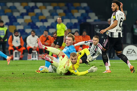 Napoli's Rasmus Hojlund, centre, scores the opening goal during the Serie A soccer match between Napoli and Juventus, in Naples, Italy.