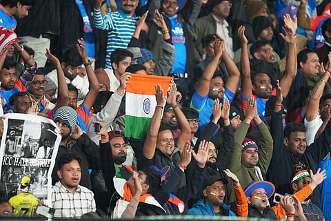 India's fans cheer on their team during the first T20 International cricket match between India and South Africa in Cuttack, India