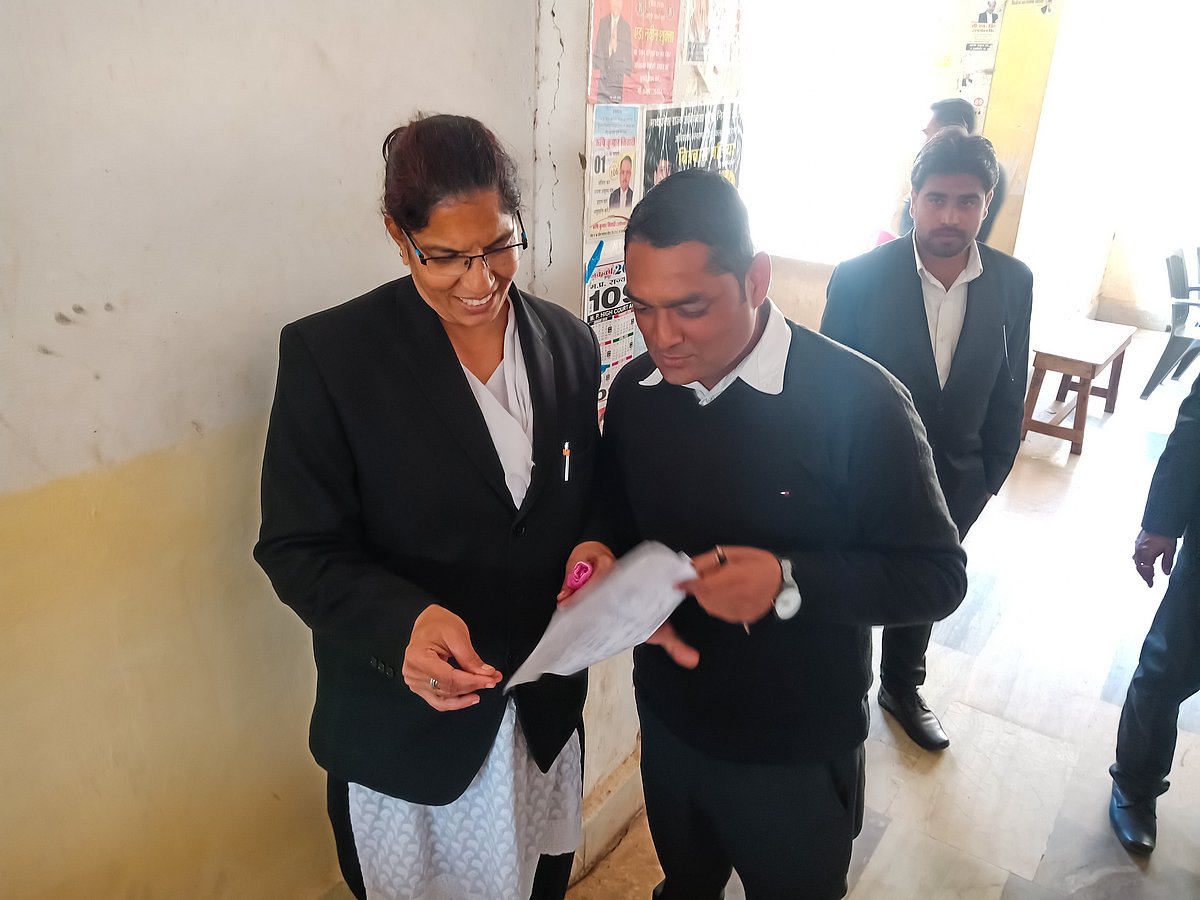 Indian woman lawyer checks documents in Supreme court