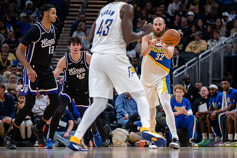 Indiana Pacers center Jay Huff (32) makes a pass during the first half of an NBA basketball game against the Sacramento Kings in Indianapolis.