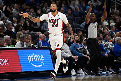 Miami Heat guard Norman Powell (24) reacts after scoring a 3-pointer against the Orlando Magic during the second half of an NBA Cup basketball game, in Orlando, Florida.