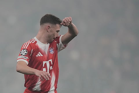 Bayern's Joshua Kimmich reacts after scoring an own goal during the Champions League opening phase soccer match between FC Bayern Munich and Sporting CP in Munich, Germany.