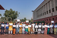 | Photo: PTI/Salman Ali : Trinamool Congress (TMC) MPs Kirti Azad, Yusuf Pathan, Dola Sen, Sagarika Ghose, Saayoni Ghosh and others hold blank white papers as they stage a protest demanding the government to come out with a white paper on funds allocated to West Bengal under the MGNREGS and PMAY, during the Winter session of Parliament, in New Delhi, Wednesday, Dec. 10, 2025. 