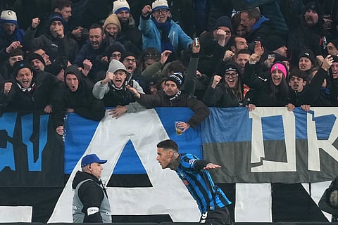 Atalanta's Gianluca Scamacca celebrates after scoring his side's first goal during the Champions League opening phase soccer match between Atalanta and Chelsea, in Bergamo, Italy.