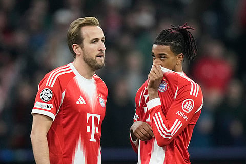 Bayern's Michael Olise, right, talks to Bayern's Harry Kane during the Champions League opening phase soccer match between FC Bayern Munich and Sporting CP in Munich, Germany.