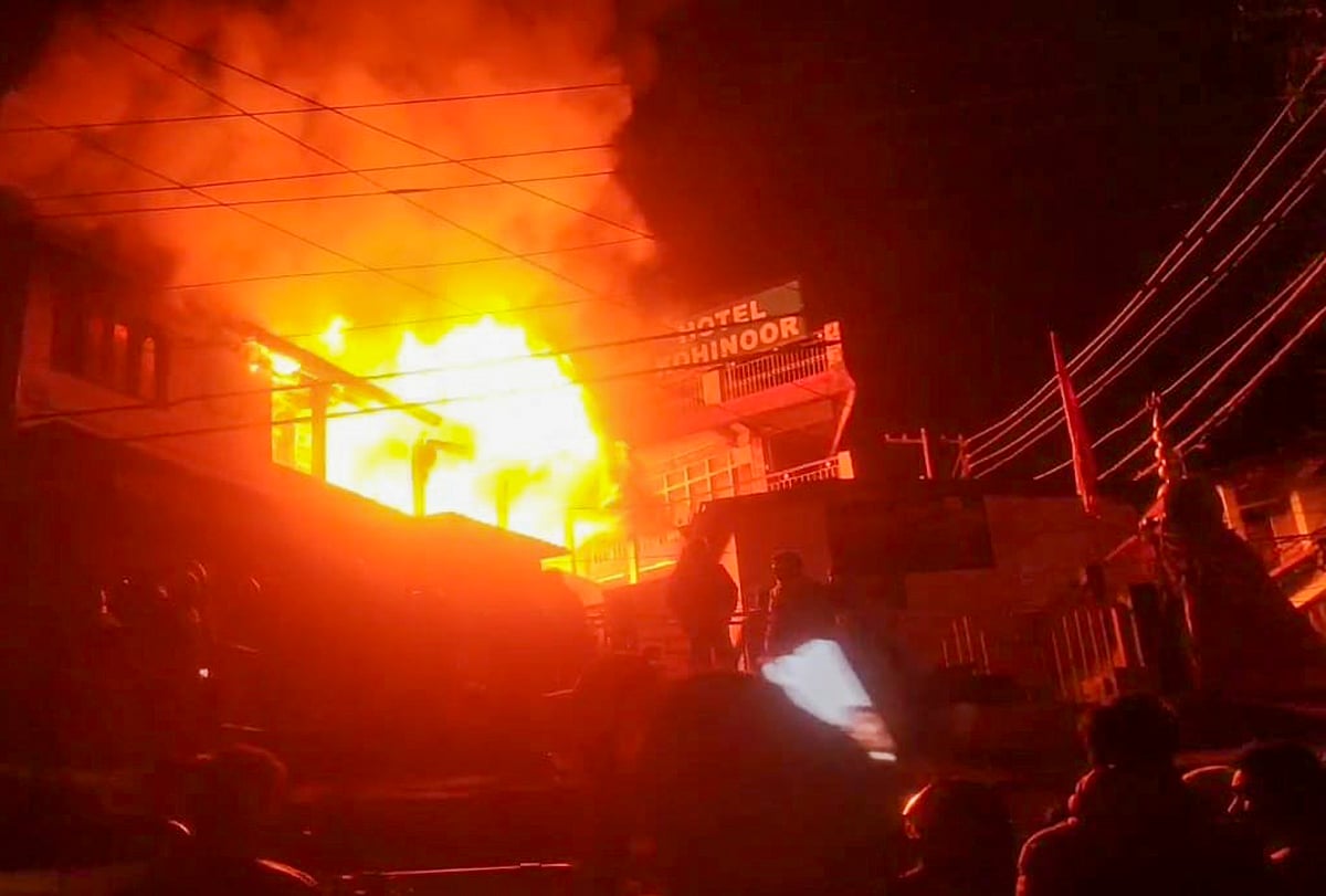 (PTI Photo) : Nainital: Smoke and flames billow out after a fire broke out at British-era building, housing Saraswati Shishu Mandir school, in Nainital, Tuesday night, Dec. 9, 2025. 