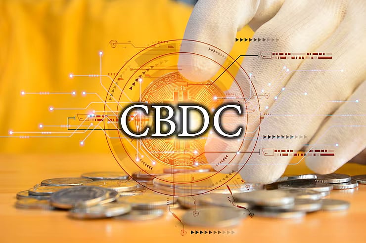Hand holding a gold Bitcoin coin above a blue digital network grid with connected nodes.