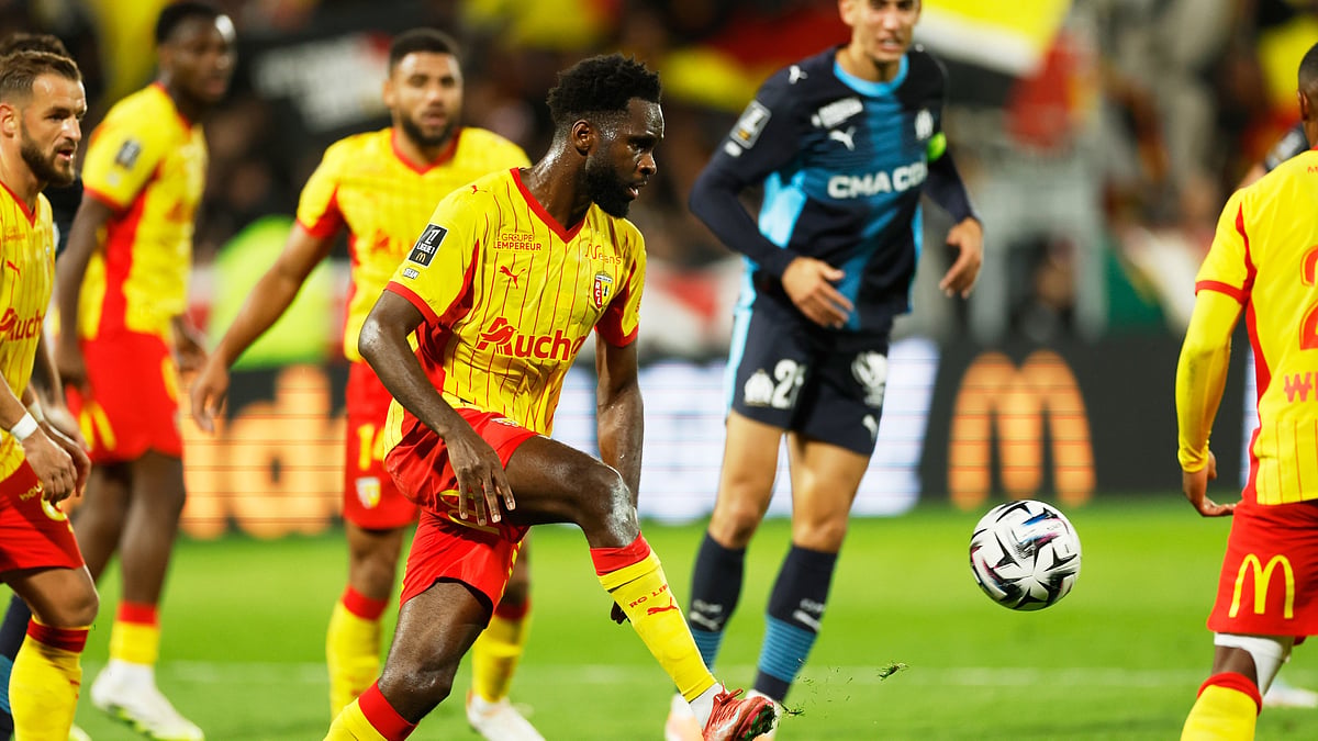 | Photo: AP/Jean-Francois Badias : Lens' Odsonne Edouard kicks the ball during the French League 1 match against Marseille on October 25, 2025. 