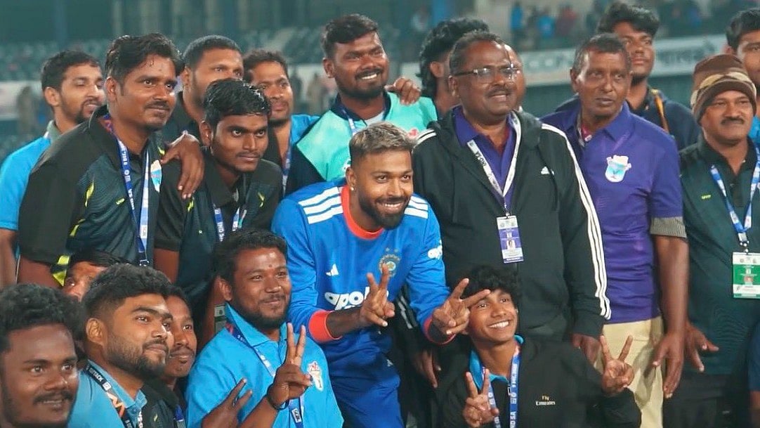 X : Hardik Pandya taking a picture with the Cuttack groundstaff