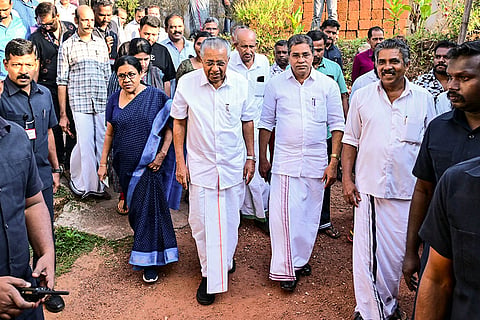 Kerala Chief Minister Pinarayi Vijayan, third from right, with family members arrives to cast his vote at a polling booth during the second phase of the state local body elections, in Kannur, Kerala.