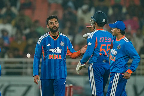 India's Varun Chakravarthy, left, celebrates with teammates after taking the wicket of South Africa’s Reeza Hendricks during the second T20 International cricket match of a series between India and South Africa, at Maharaja Yadavindra Singh International Cricket Stadium, in New Chandigarh.