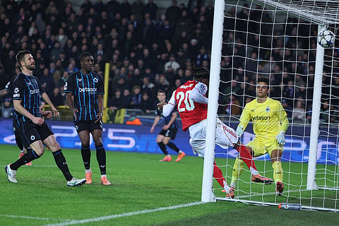 Arsenal's Noni Madueke, second right, scores his sides second goal during the Champions League opening phase soccer match between Club Brugge and Arsenal in Bruges, Belgium.