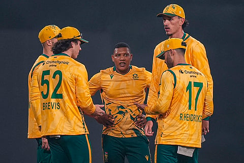 South Africa's players wait for the third umpire’s decision for the wicket of India’s Axar Patel during the second T20 International cricket match of a series between India and South Africa, at Maharaja Yadavindra Singh International Cricket Stadium, in New Chandigarh.