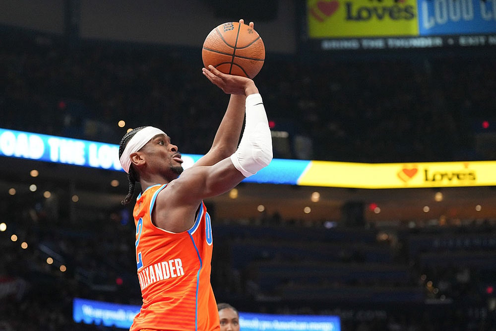 | Photo: AP/Kyle Phillips : Oklahoma City Thunder guard Shai Gilgeous-Alexander shoots during the second half of an NBA Cup basketball game against the Oklahoma City Thunder in Oklahoma City.