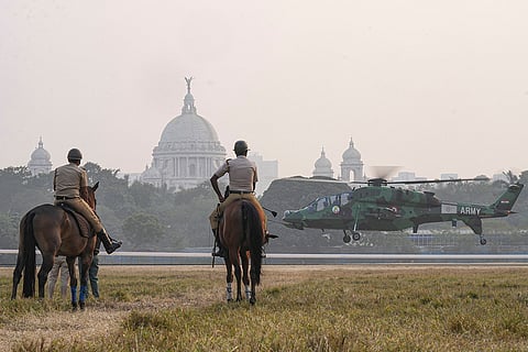 Mounted police personnel keep vigil as an army helicopter conducts a rehearsal ahead of 'Vijay Diwas' celebrations, including the Eastern Command's 'military tattoo', at Maidan, in Kolkata. Vijay Diwas, observed on Dec. 16, marks India's victory in the 1971 Indo-Pak war that led to the creation of Bangladesh. 