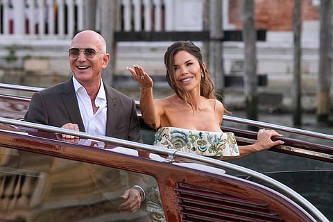 Jeff Bezos and Lauren Sanchez leave a hotel for their pre-wedding reception in Venice, Italy, June 26, 2025. 
