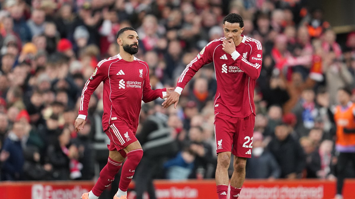 (AP Photo/Jon Super) : Liverpool's Mohamed Salah, left, and Liverpool's Hugo Ekitike during the English Premier League soccer match between Liverpool and Brighton and Hove Albion in Liverpool, England, Saturday, Dec. 13, 2025.