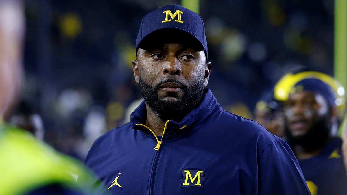 (AP Photo/Al Goldis, File) : FILE - Michigan coach Sherrone Moore walks off the field following an NCAA football game on Saturday, Aug. 30, 2025, in Ann Arbor, Mich
