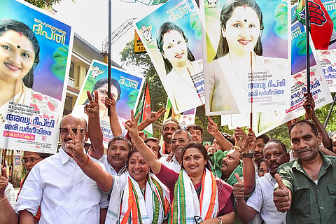 UDF candidate Deepthi Mary Varghese, centre, and others celebrate after the alliance’s victory in Kerala's local body elections, in Kochi.