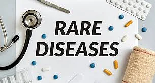Rare Diseases printed on paper with medical things around it