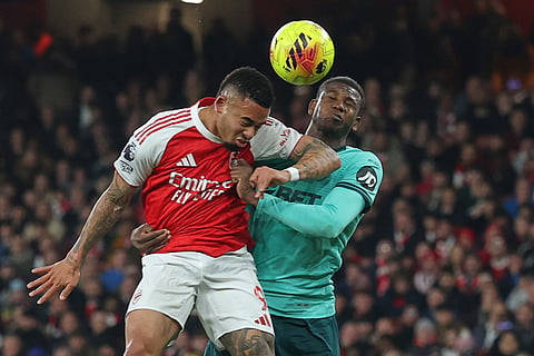 Arsenal's Gabriel Jesus, left, scores his side's second goal during the English Premier League soccer match between Arsenal and Wolves in London.