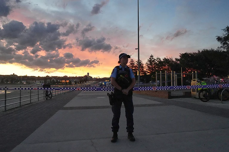 Police cordon off an area at Bondi Beach after a reported shooting in Sydney. - | Photo: AP/Mark Baker