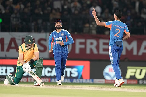 India's Arshdeep Singh, right, celebrates the wicket of South Africa's captain Aiden Markram, left, during the third T20 cricket match between India and South Africa in Dharamshala.