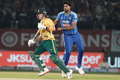 India's Harshit Rana, right, and South Africa's Dewal Brevis during the third T20 cricket match between India and South Africa in Dharamshala.
