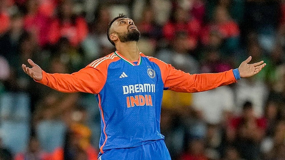 | Photo: AP/Themba Hadebe : Ind vs SA 3rd T20I: India's Varun Chakravarthy celebrates the dismissal of South Africa's Reeza Hendricks