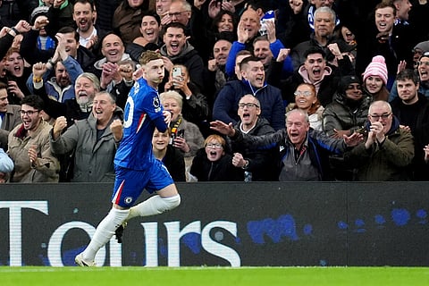 Chelsea's Cole Palmer celebrates after scoring his sides first goal during the English Premier League soccer match between Chelsea and Everton in London.