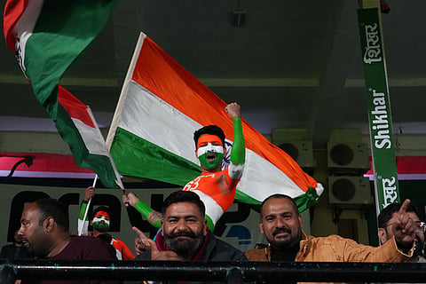 Indian fans cheers before the start of the third T20 cricket match between India and South Africa in Dharamshala.