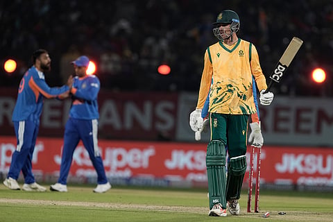 South Africa's Marco Jansen, right, leaves the ground after losing his wicket during the third T20 cricket match between India and South Africa in Dharamshala.