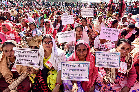 Agricultural workers take part in a rally against anti-people policies and labour code, at Lachit Ghat in Guwahati.