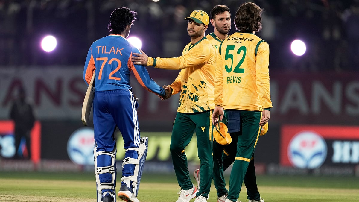 (AP Photo/Ashwini Bhatia) : South Africa's captain Aiden Markram congratulate India's Tilak Varma, left, after India won the match during the third T20 cricket match between India and South Africa in Dharamshala, India, Sunday, Dec. 14, 2025
