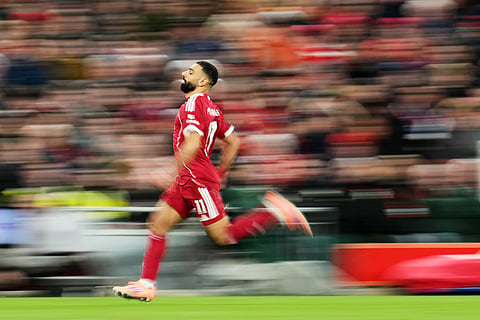 Liverpool's Mohamed Salah in action during the English Premier League soccer match between Liverpool and Brighton and Hove Albion in Liverpool, England.