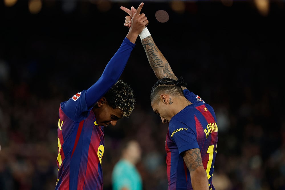 | Photo: AP/Joan Monfort : Barcelona's Raphinha and Lamine Yamal celebrate after a goal during a La Liga soccer match between Barcelona and Osasuna in Barcelona, Spain.