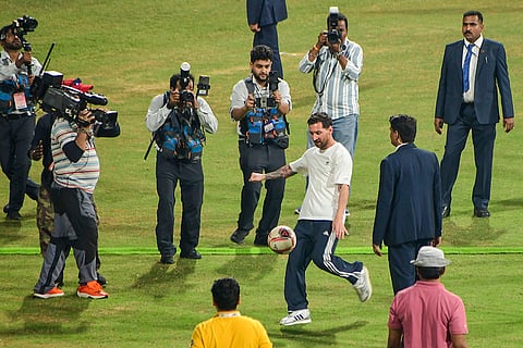 Argentine footballer Lionel Messi kicks a football during the 'GOAT India Tour 2025', at Wankhede Stadium, in Mumbai.