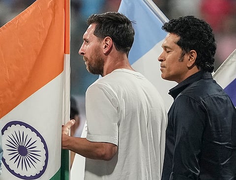 Cricket legend Sachin Tendulkar, right, and Argentine football superstar Lionel Messi during an event as part of the ‘GOAT India Tour 2025’, at the Wankhede Stadium, in Mumbai.