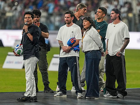 Cricket legend Sachin Tendulkar with Argentine footballer and 2022 FIFA World Cup winning captain Lionel Messi and his Inter Miami teammates Rodrigo De Paul and Luis Suarez  during an event as part of the 'GOAT India Tour 2025', at the Wankhede Stadium, in Mumbai.