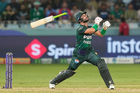 Pakistan's Sahibzada Farhan looses grip on his bat while playing a shot during the Asia Cup cricket match between India and Pakistan at Dubai International Cricket Stadium in Dubai, United Arab Emirates, Sept. 21, 2025. 