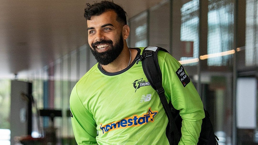 | Photo: X/ThunderBBL : Shadab Khan scored crucial 34 runs and took two wickets in his first Big Bash League match against Hobart Hurricanes on December 16, 2025.