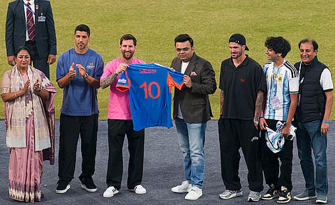 From left, Delhi Chief Minister Rekha Gupta, Uruguayan footballer Luis Suarez, Argentine footballer Lionel Messi, ICC Chairman Jay Shah, Argentine footballer Rodrigo De Paul and others during an event as part of the 'GOAT India Tour 2025', at Arun Jaitley Stadium in New Delhi.