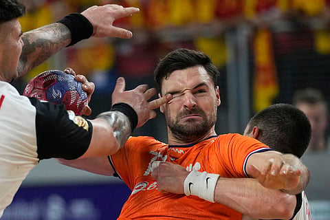 Dani Baijens, of the Netherlands, center, tries to score during the second round, group D, handball match between The Netherlands and North Macedonia at the Handball Men's World Championship in Varazdin, Croatia, Jan. 17, 2025. 