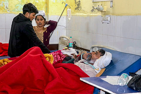Injured passengers receive treatment at a hospital after a fog-hit pile-up involving buses and cars sparked fires on the Yamuna Expressway, in Mathura.